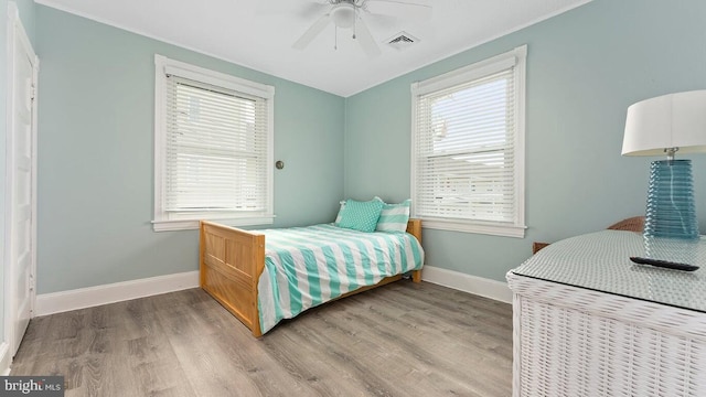 bedroom featuring hardwood / wood-style flooring and ceiling fan