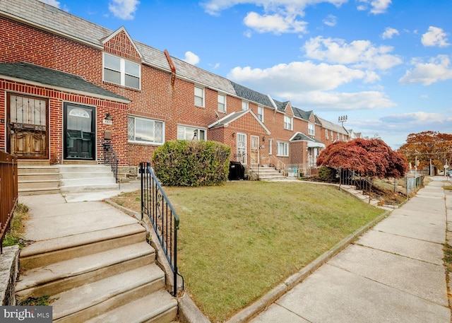 view of front of home with a front yard