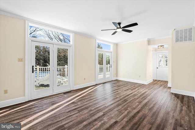 unfurnished living room with dark wood-type flooring, ornamental molding, and ceiling fan