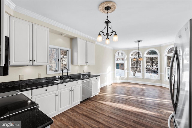 kitchen featuring an inviting chandelier, sink, white cabinetry, and appliances with stainless steel finishes