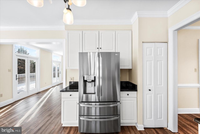 kitchen featuring stainless steel refrigerator with ice dispenser, white cabinetry, crown molding, and dark wood-type flooring