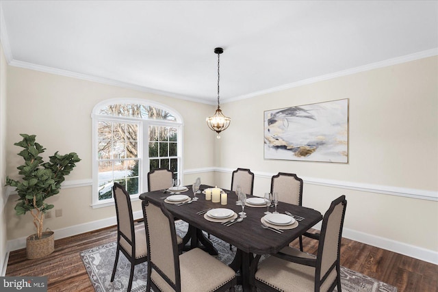 dining space with dark hardwood / wood-style flooring and ornamental molding