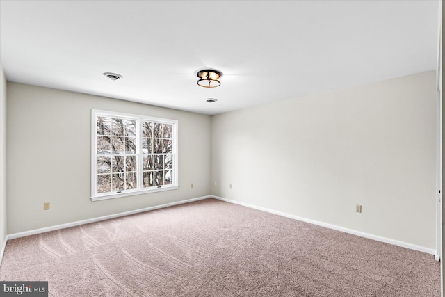 empty room featuring carpet flooring