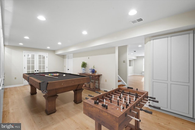 game room with light hardwood / wood-style flooring, pool table, and french doors