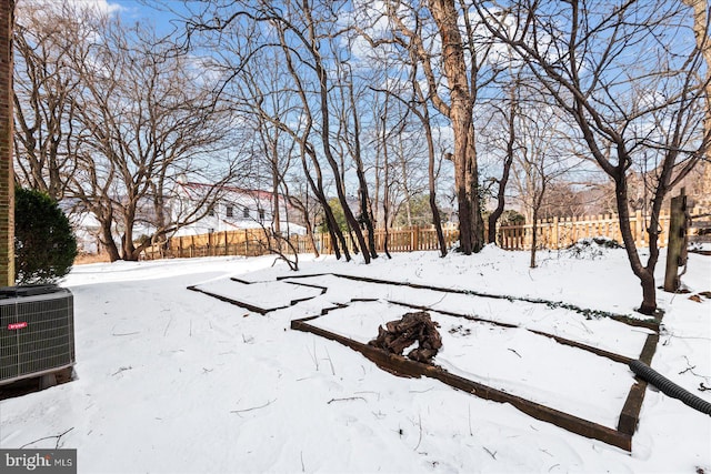 yard layered in snow with central AC unit