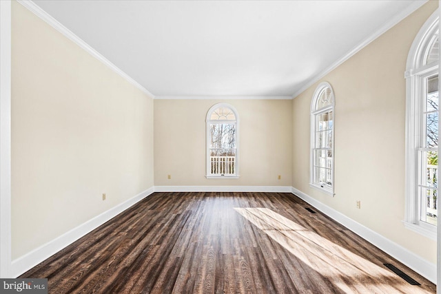 empty room with ornamental molding and dark wood-type flooring