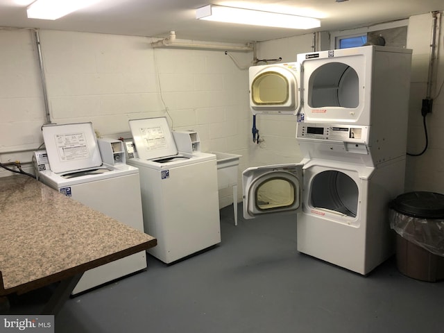 laundry area featuring washer and clothes dryer and stacked washer / drying machine