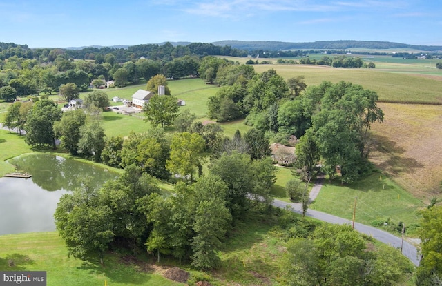 drone / aerial view featuring a rural view and a water view