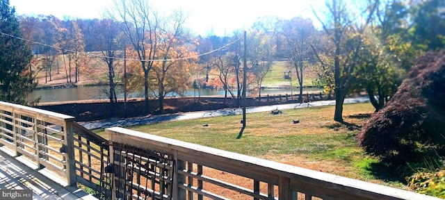 balcony featuring a water view