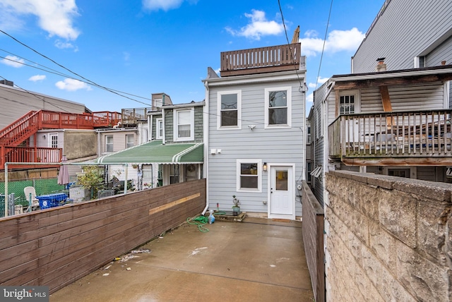 back of property featuring a patio area