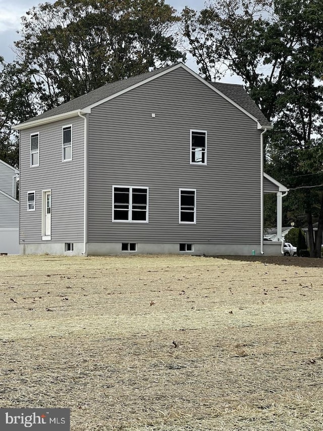 view of property exterior featuring a lawn