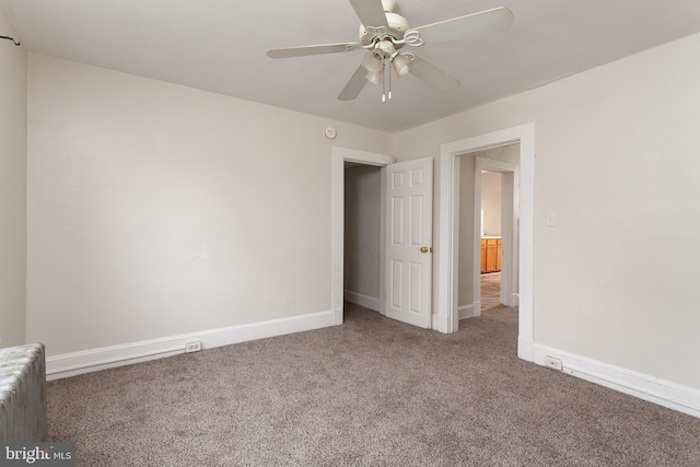 unfurnished bedroom featuring ceiling fan and carpet floors