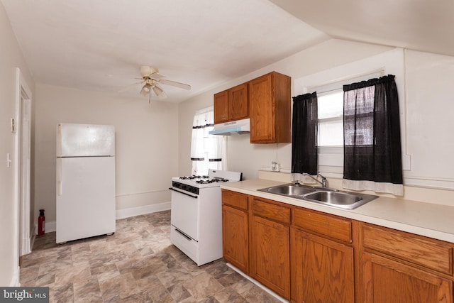 kitchen featuring ceiling fan, sink, a healthy amount of sunlight, and white appliances