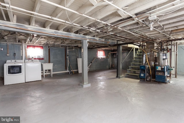 basement featuring washer and dryer and sink