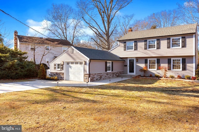 view of front facade with a front lawn and a garage