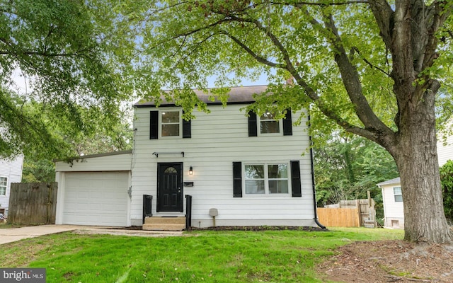 colonial-style house with a garage and a front lawn