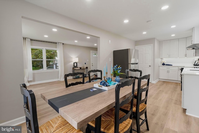 dining room with light hardwood / wood-style flooring