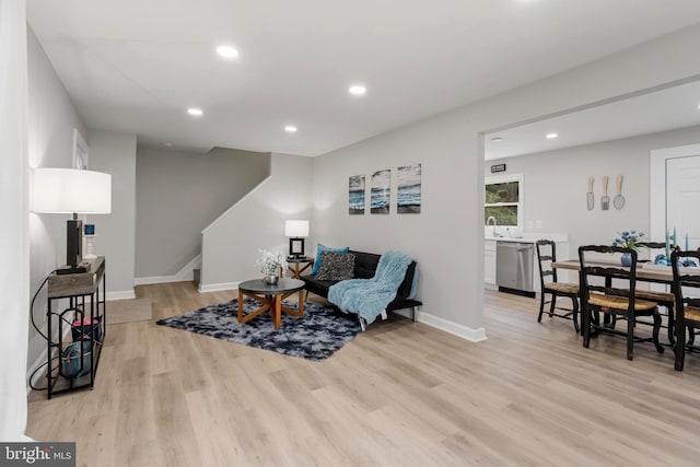 sitting room featuring light hardwood / wood-style flooring