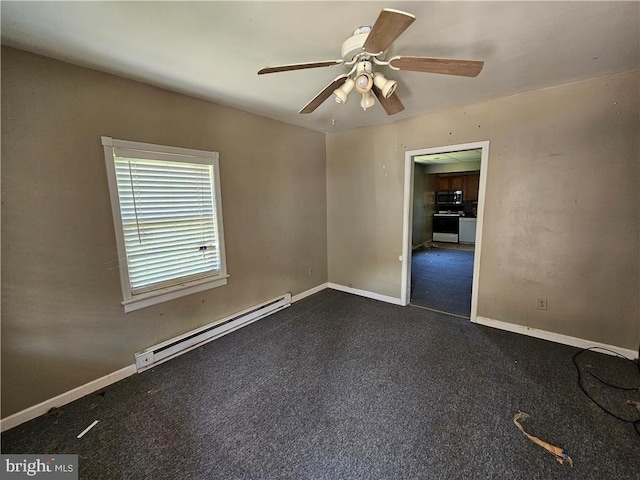 empty room with baseboard heating and ceiling fan