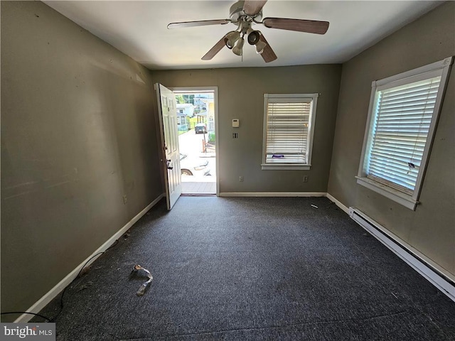 empty room featuring ceiling fan and a baseboard radiator