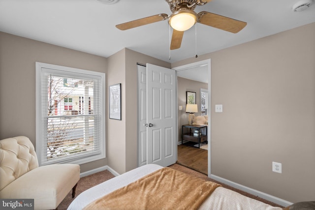 bedroom featuring ceiling fan, carpet, and a closet