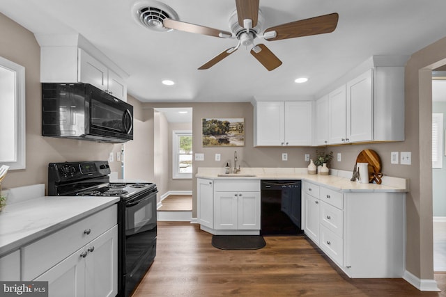 kitchen with ceiling fan, dark hardwood / wood-style floors, black appliances, sink, and white cabinetry