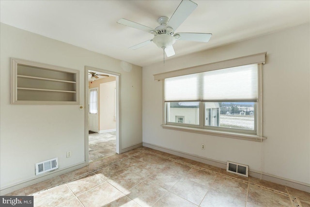 spare room featuring ceiling fan