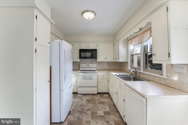 kitchen with white cabinetry, white appliances, sink, and tasteful backsplash