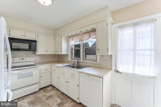 kitchen with white cabinets, white appliances, tasteful backsplash, and sink