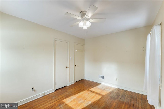 unfurnished bedroom with hardwood / wood-style floors and ceiling fan