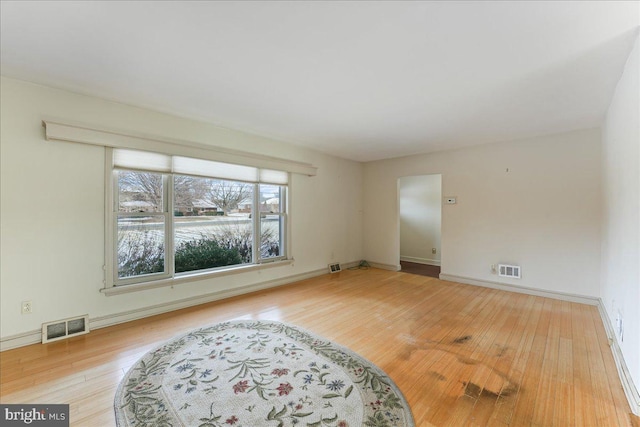 unfurnished room featuring wood-type flooring