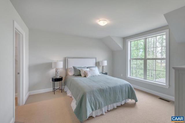 bedroom featuring light carpet