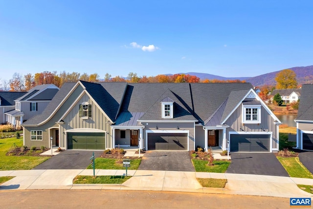 view of front of property featuring a mountain view and a garage