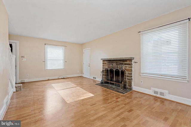 unfurnished living room with light wood-type flooring