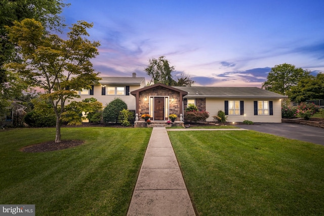 view of front of property with a yard