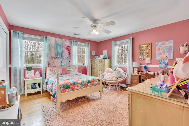 bedroom with hardwood / wood-style flooring and ceiling fan