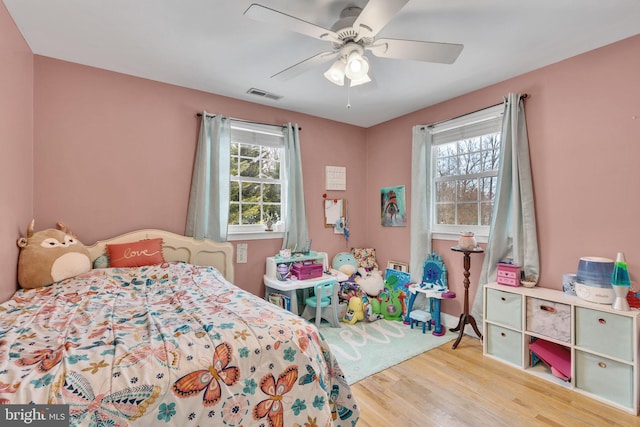 bedroom featuring ceiling fan and light hardwood / wood-style flooring