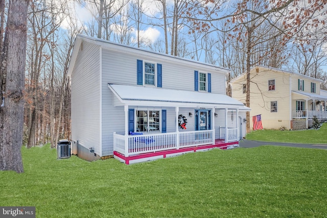 view of front facade with covered porch, central AC unit, and a front yard