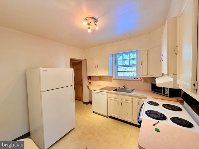 kitchen with white cabinets, white appliances, and sink