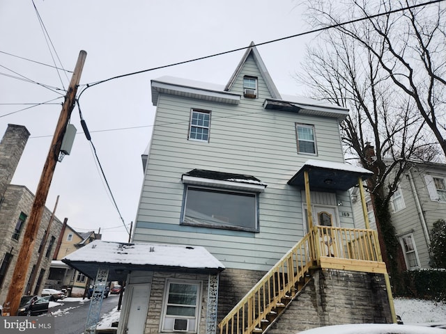 view of front of home with cooling unit