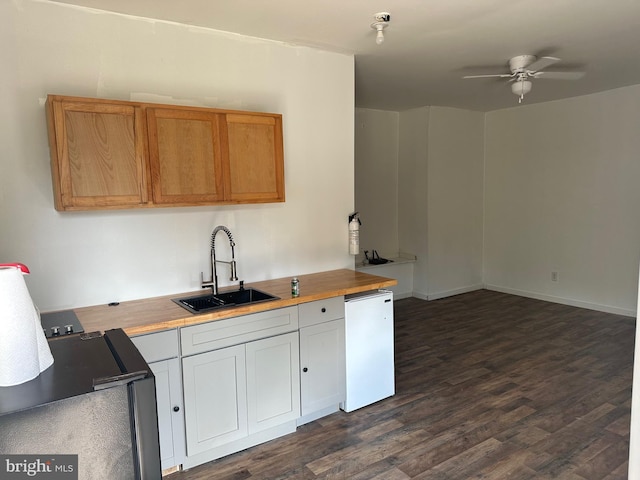 kitchen featuring sink, white cabinets, ceiling fan, white dishwasher, and dark hardwood / wood-style flooring