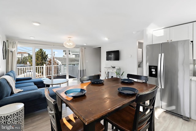 dining area with light hardwood / wood-style flooring