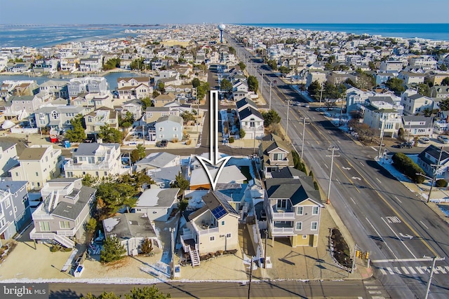 drone / aerial view with a water view