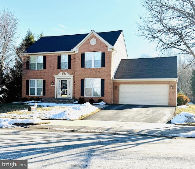 colonial home with a garage