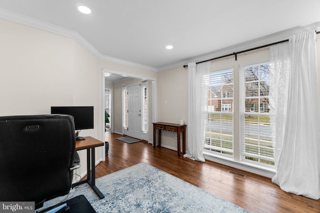 office area featuring dark wood-type flooring, ornamental molding, and plenty of natural light