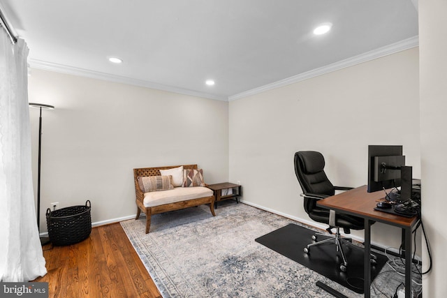 office area with wood-type flooring and ornamental molding