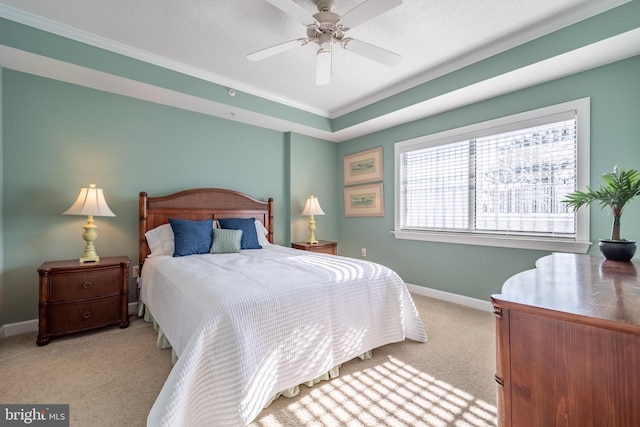 bedroom featuring a textured ceiling, light colored carpet, ceiling fan, and crown molding