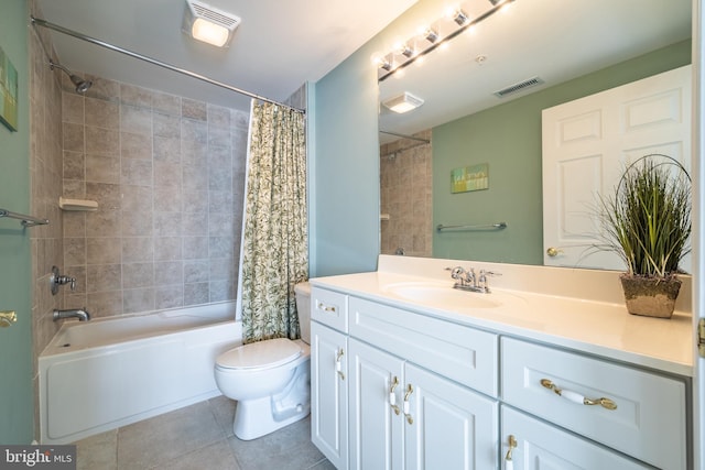 full bathroom featuring tile patterned floors, vanity, toilet, and shower / bath combo with shower curtain