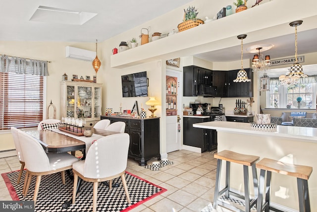 kitchen with pendant lighting, light tile patterned floors, a wealth of natural light, and a wall mounted AC