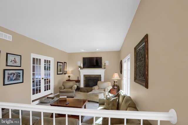 living room with a fireplace and french doors